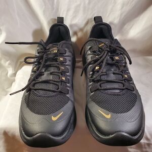 Nike Black Sneakers with Gold Swoosh Accents